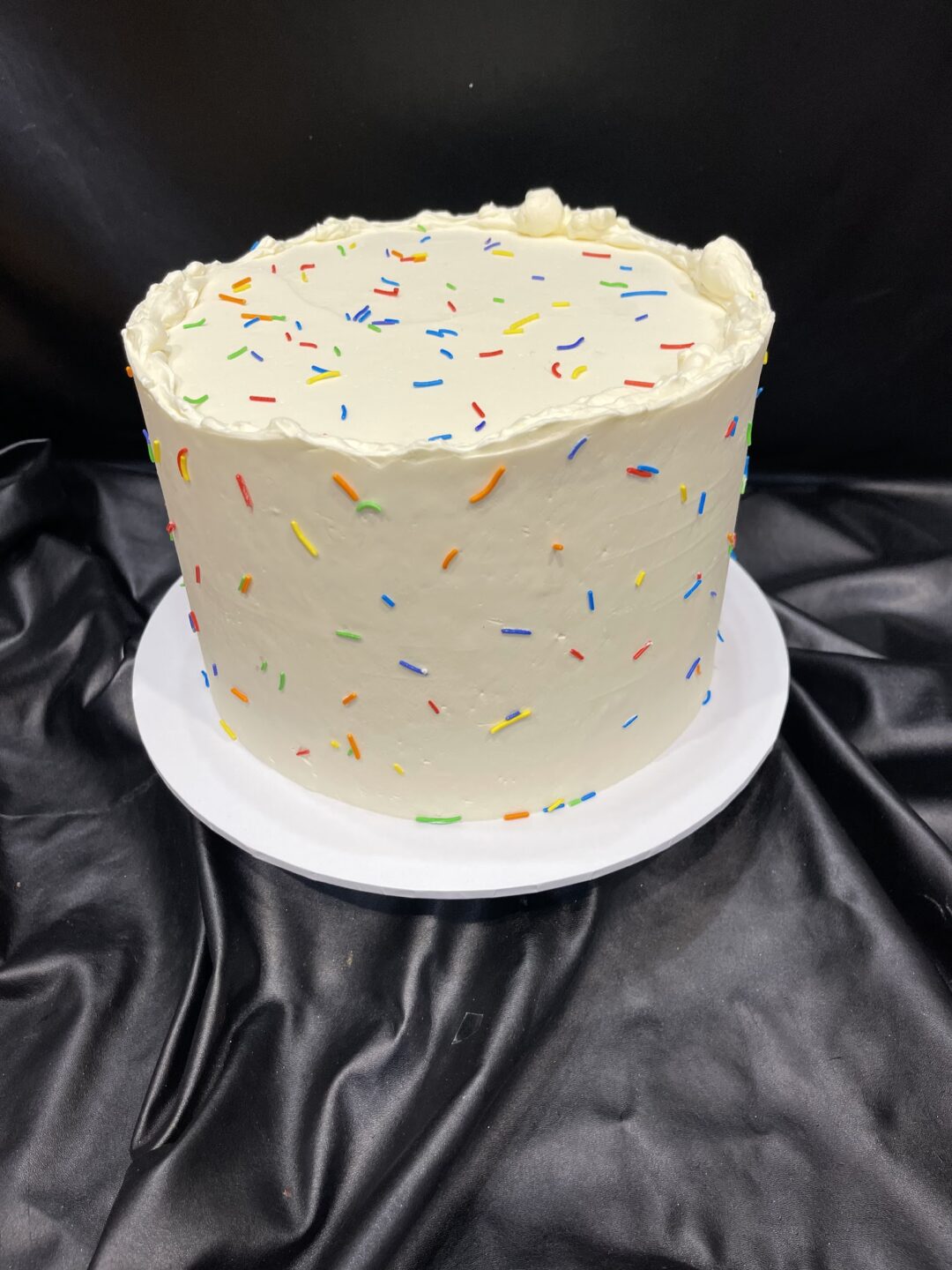 Smooth Buttercream with Scattered Sprinkles or Confetti